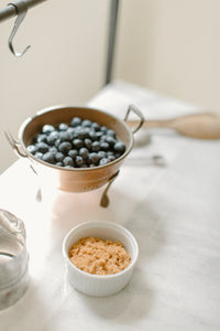 footed copper berry colander